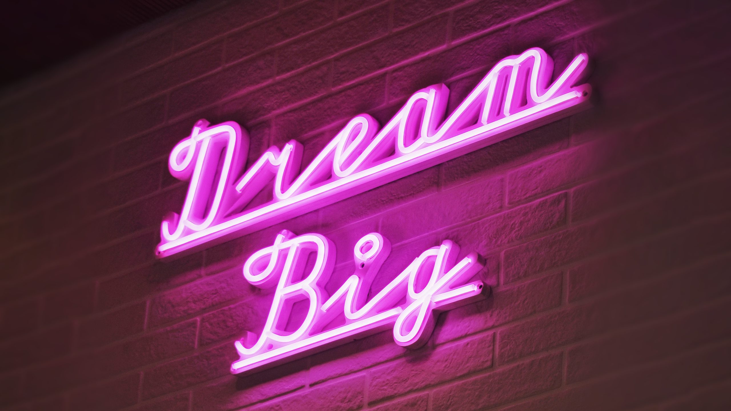 Image of a neon sign saying Dream Big